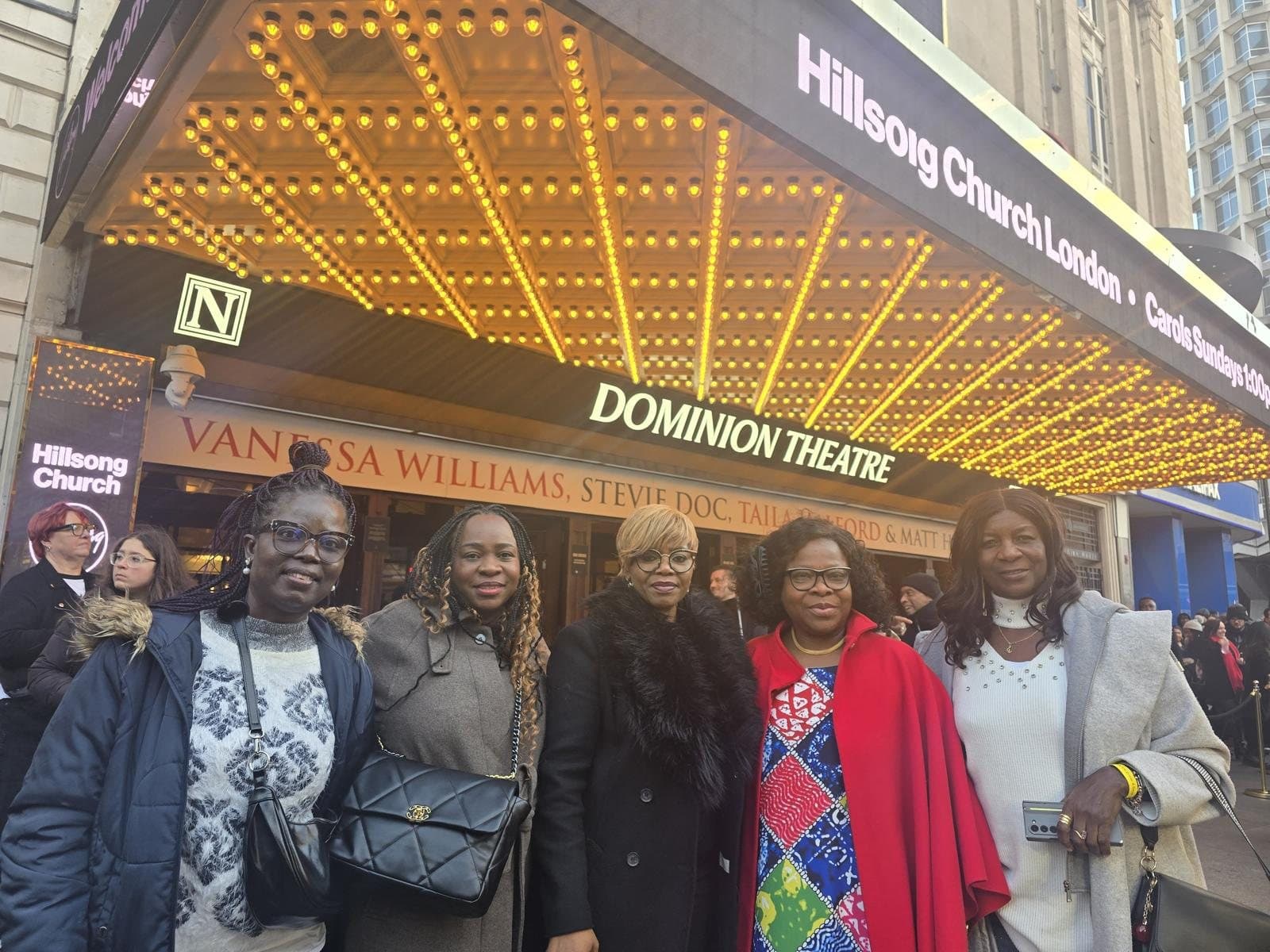 Five members of Modern Ladies Foundation outside the Dominion Theatre in London